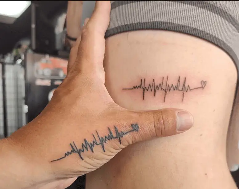 Tattoos depicting heartbeats, a visual representation of the love and unity between parents