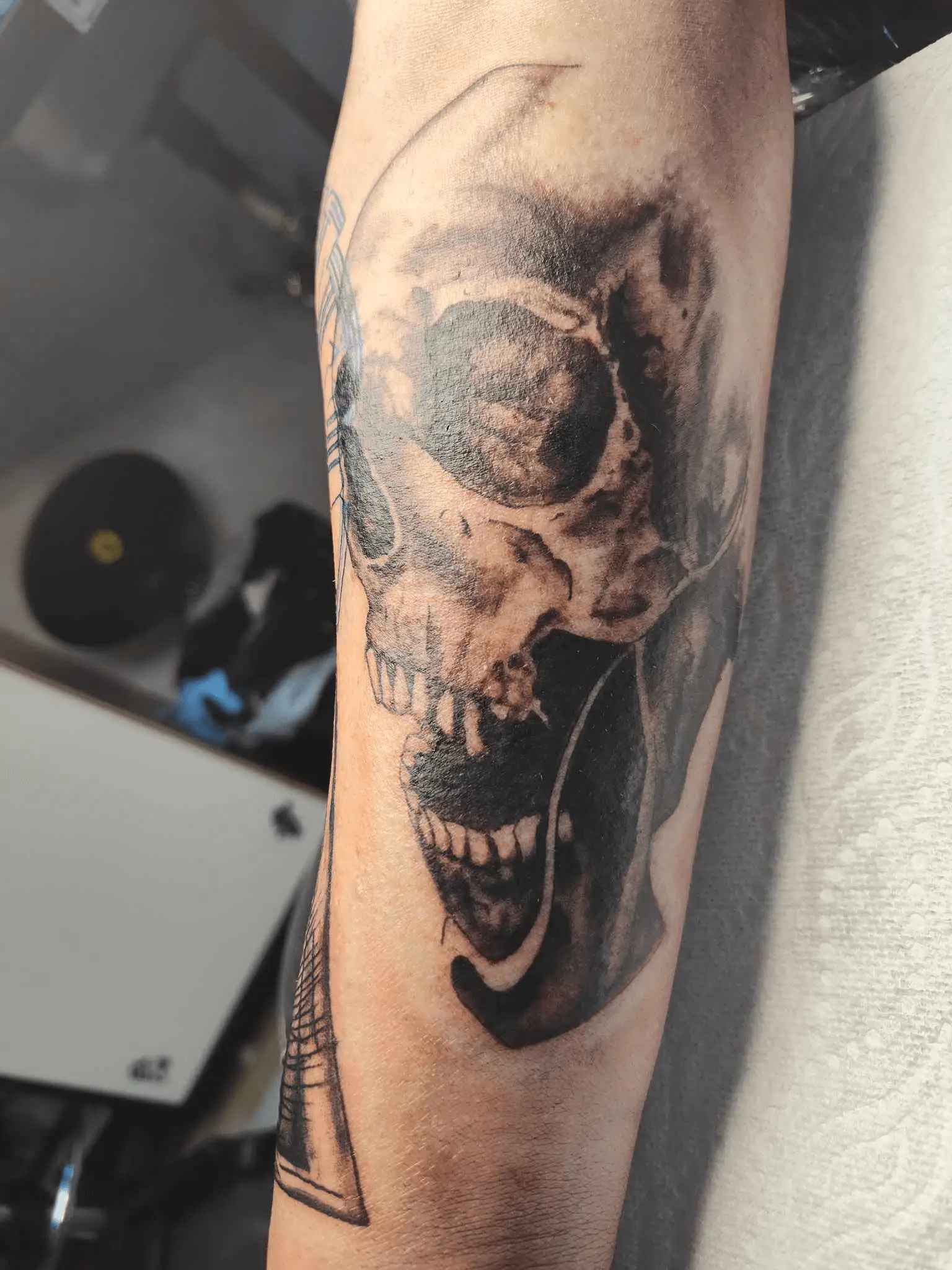 Tattoo featuring an artistic interpretation of a skull