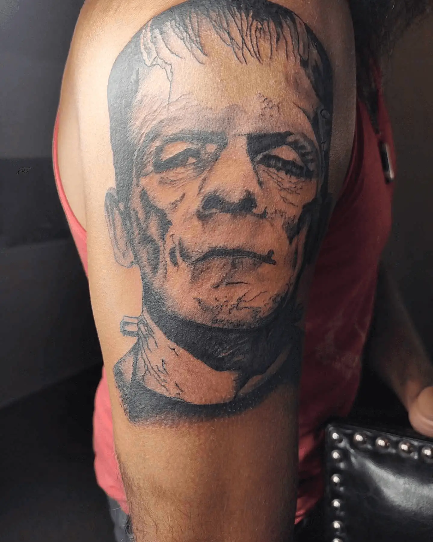 Tattoo close-up showcasing a detailed portrait of Mr. Munster