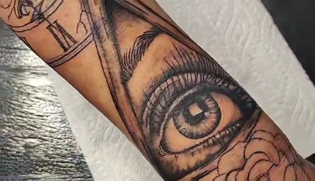 Tattoo video featuring a pyramid with an eye in the middle by Brianna Lyons