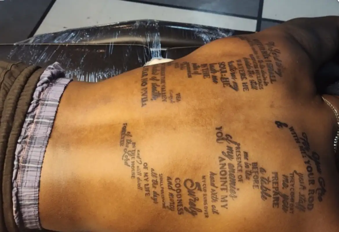 BL-ink Tattoo Colorado Springs full-back script: Psalm 23 verses arranged in a flowing word-cloud layout across the entire back.