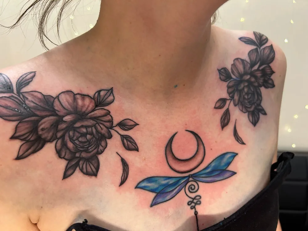 Dragonfly and floral chest tattoo from BL-INK